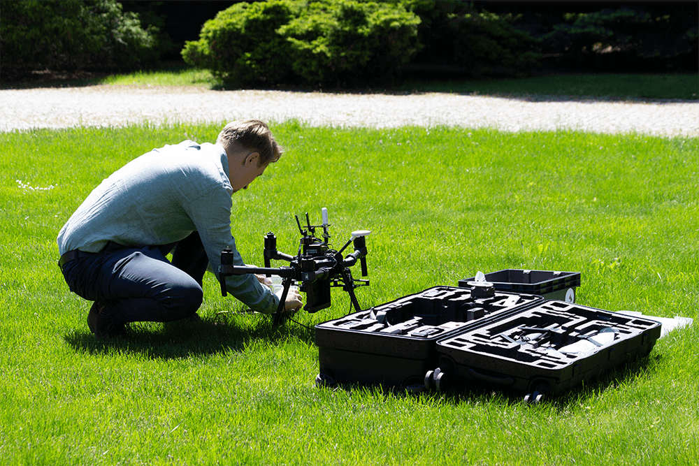 photo showing the operator preparing the drone for takeoff